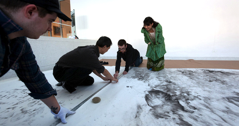 The installation crew used wheat paste to attach the rice-paper panels