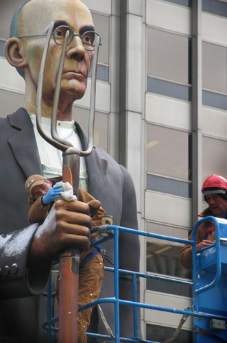 Workers install Johnson's God Bless America in Pioneer Court